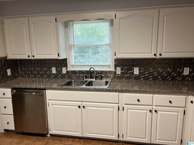 kitchen featuring white cabinetry, sink, tile flooring, stainless steel dishwasher, and tasteful backsplash