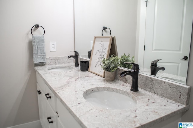 bathroom with dual bowl vanity