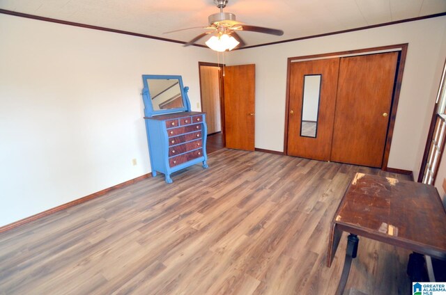 unfurnished bedroom with a closet, ceiling fan, and light wood-type flooring