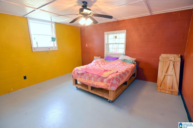 bedroom featuring ceiling fan and multiple windows