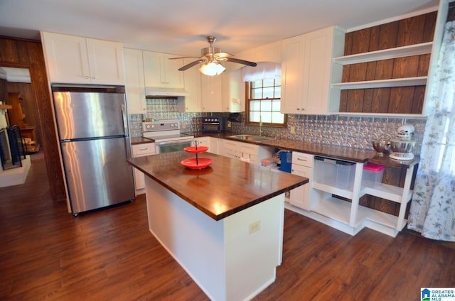 kitchen featuring stainless steel refrigerator, white cabinetry, white range with electric cooktop, and dark hardwood / wood-style floors