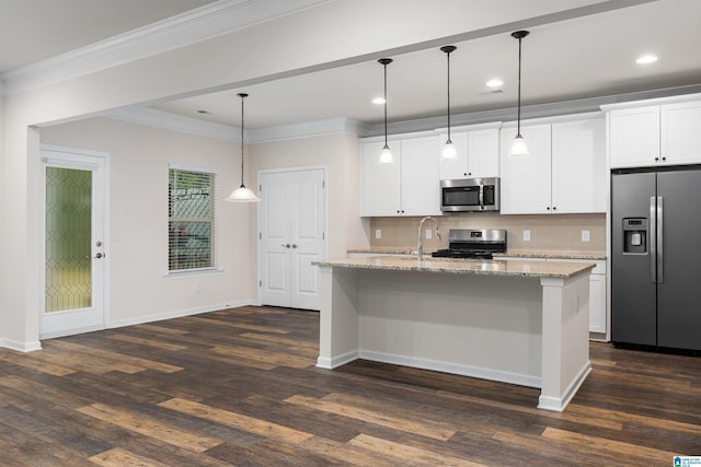 kitchen with light stone countertops, stainless steel appliances, dark wood-type flooring, and a kitchen island with sink