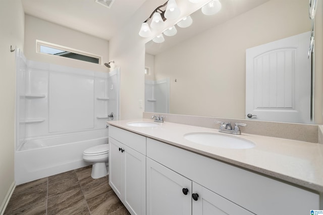 full bathroom with  shower combination, tile flooring, toilet, double sink, and large vanity