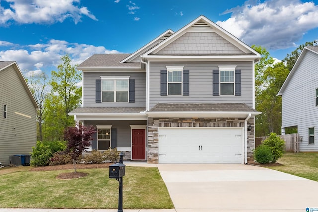 craftsman-style house with a front yard and a garage