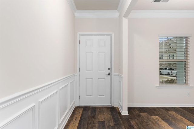 doorway with crown molding and dark hardwood / wood-style flooring