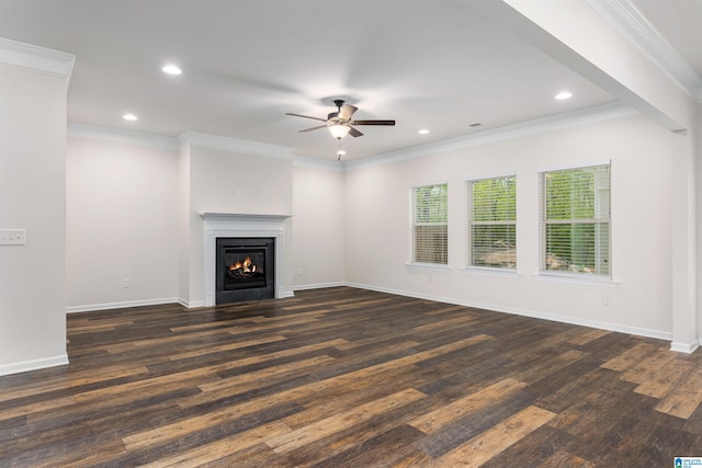 unfurnished living room with ceiling fan, dark hardwood / wood-style floors, and crown molding