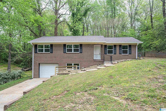 view of front of home with a garage and a front lawn