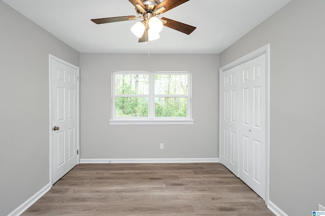 spare room featuring ceiling fan and dark hardwood / wood-style flooring