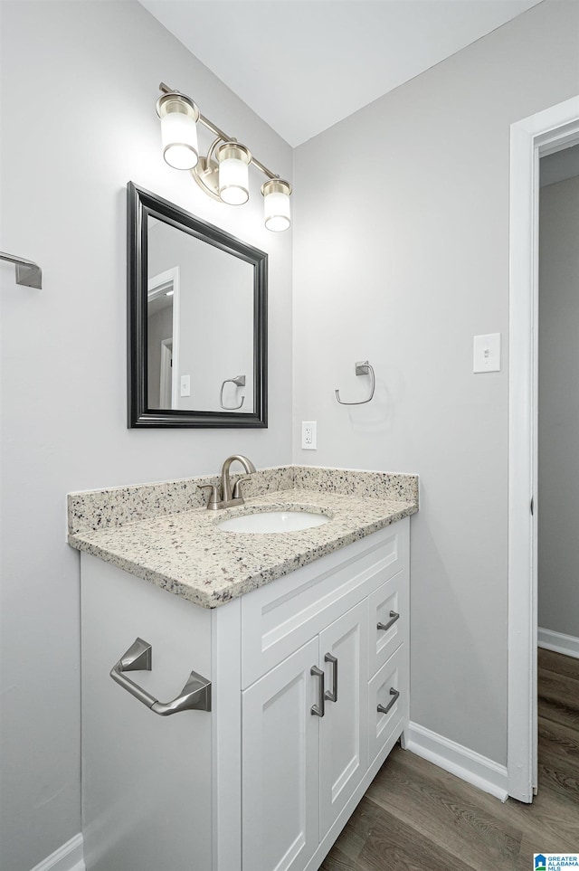 bathroom featuring vanity and wood-type flooring