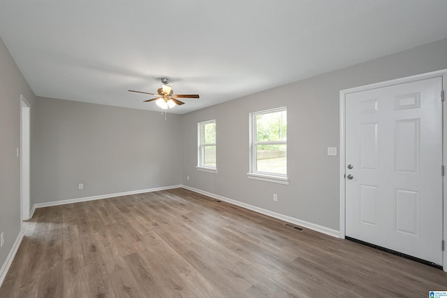 spare room with ceiling fan and dark hardwood / wood-style floors