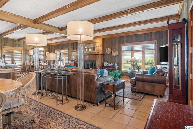 living room featuring a healthy amount of sunlight, wooden walls, and light tile flooring