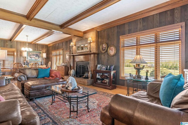 living room with beam ceiling and wood walls