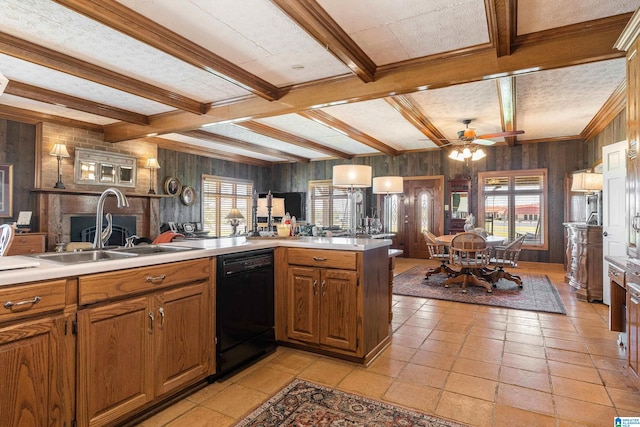kitchen with ceiling fan, wood walls, beam ceiling, and black dishwasher