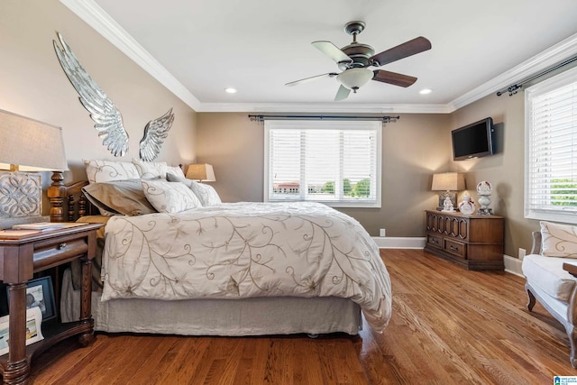 bedroom featuring ornamental molding, ceiling fan, and light hardwood / wood-style flooring