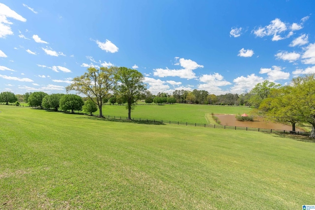 view of yard with a rural view