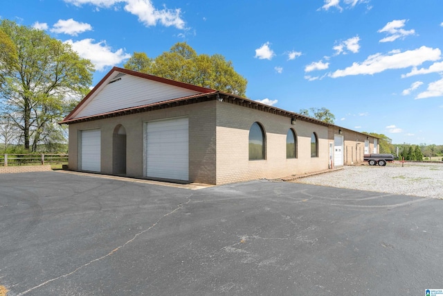 exterior space with an outdoor structure and a garage