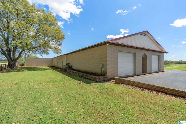 view of side of home featuring a lawn