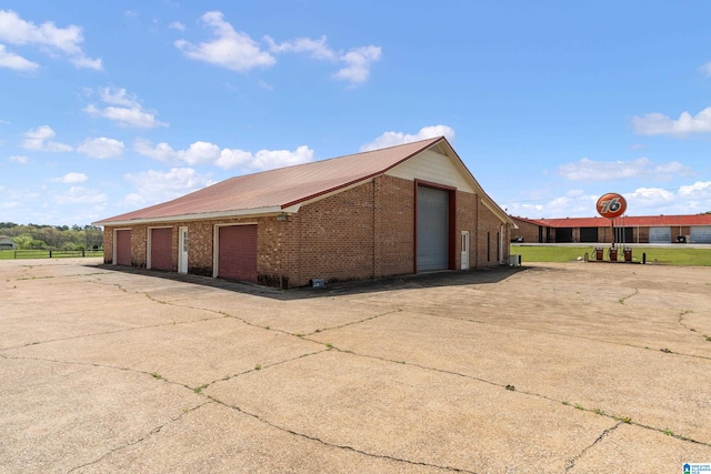 exterior space with an outdoor structure and a garage