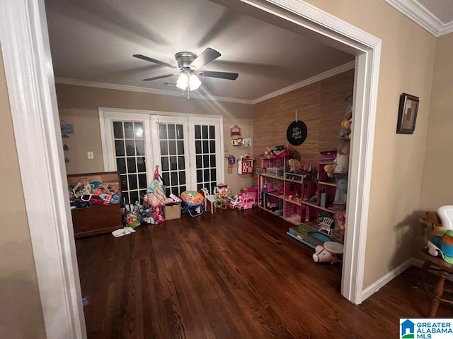 misc room with ceiling fan, dark wood-type flooring, ornamental molding, and french doors