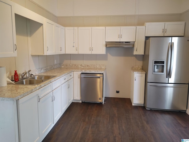 kitchen with white cabinetry, dark wood-type flooring, appliances with stainless steel finishes, and sink