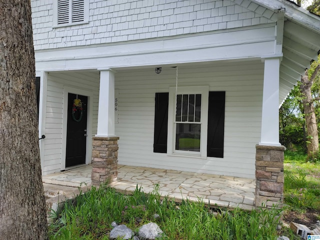 doorway to property featuring covered porch