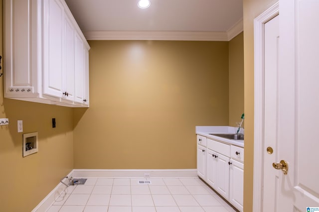 laundry area featuring sink, crown molding, washer hookup, and cabinets