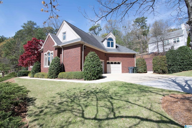 view of front of house with a front lawn and a garage