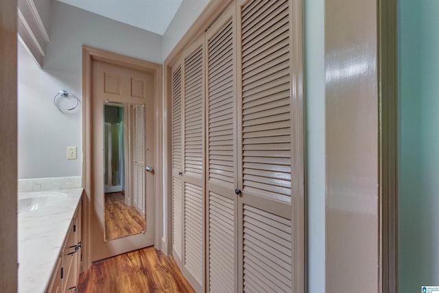 corridor with light hardwood / wood-style floors