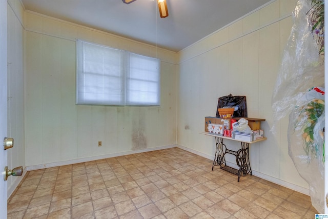 tiled spare room with crown molding and ceiling fan