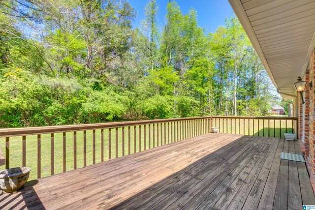 wooden deck with a yard