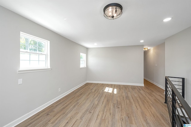 empty room with light hardwood / wood-style flooring