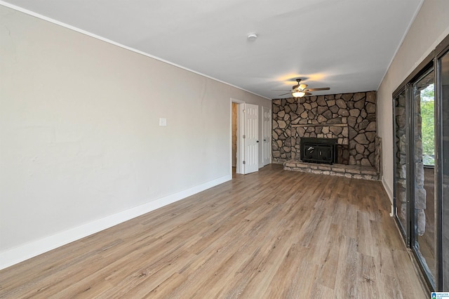 unfurnished living room featuring ceiling fan and light hardwood / wood-style floors