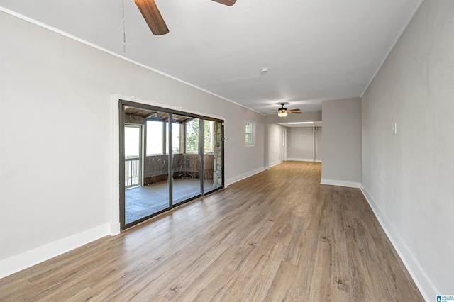 unfurnished room featuring ornamental molding, light hardwood / wood-style flooring, and ceiling fan