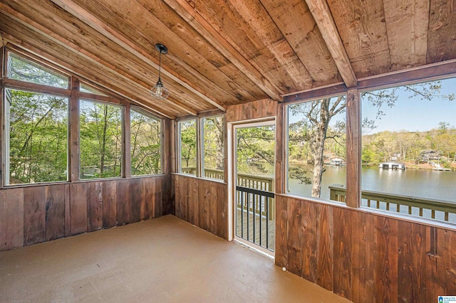 unfurnished sunroom featuring wood ceiling, a water view, and vaulted ceiling