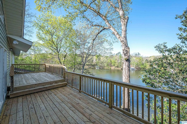 wooden deck featuring a water view