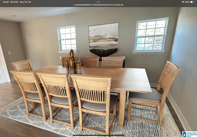 dining area with dark hardwood / wood-style floors