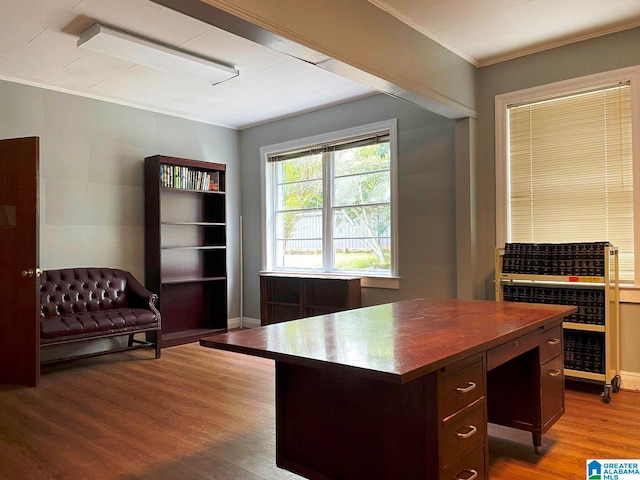 home office with ornamental molding and light wood-type flooring