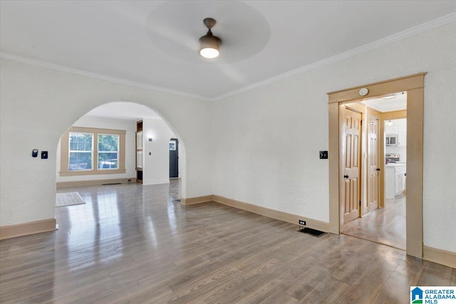 empty room with crown molding, ceiling fan, and hardwood / wood-style floors