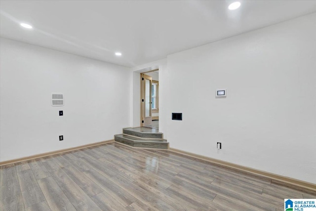 spare room with light hardwood / wood-style flooring