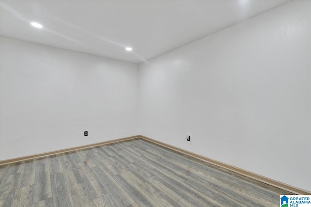 unfurnished room with hardwood / wood-style floors