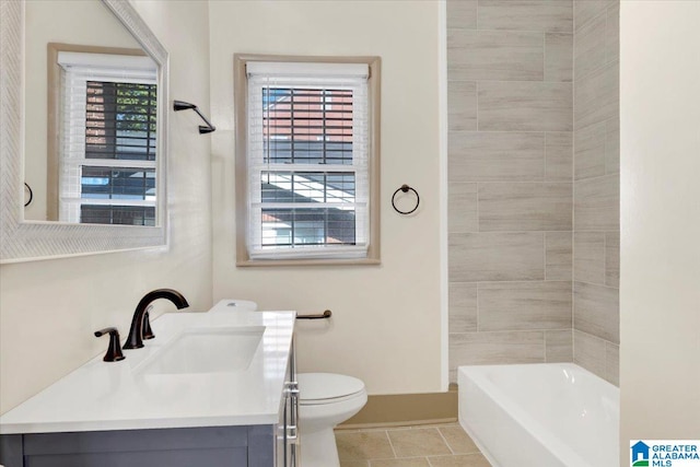 bathroom featuring tile patterned flooring, vanity, and toilet