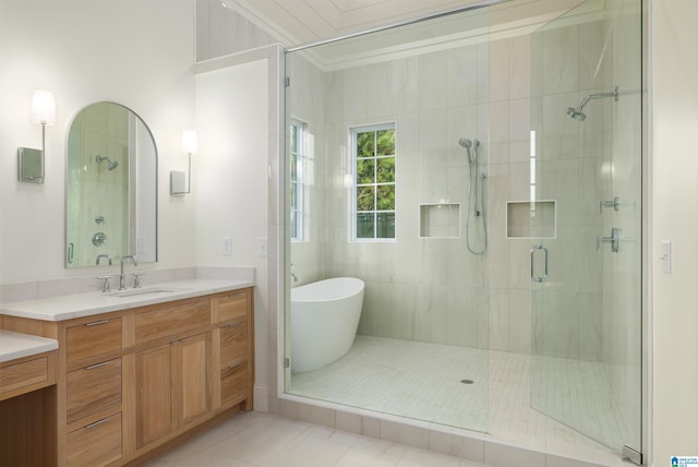 bathroom with tile patterned floors, vanity, crown molding, and independent shower and bath