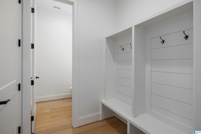 mudroom with hardwood / wood-style floors