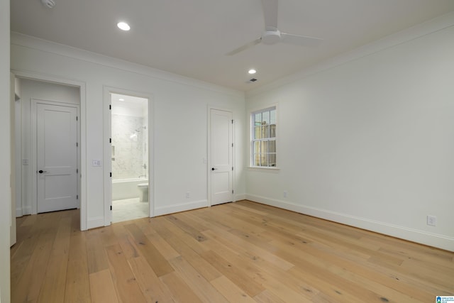 unfurnished bedroom with connected bathroom, light hardwood / wood-style flooring, ceiling fan, and ornamental molding