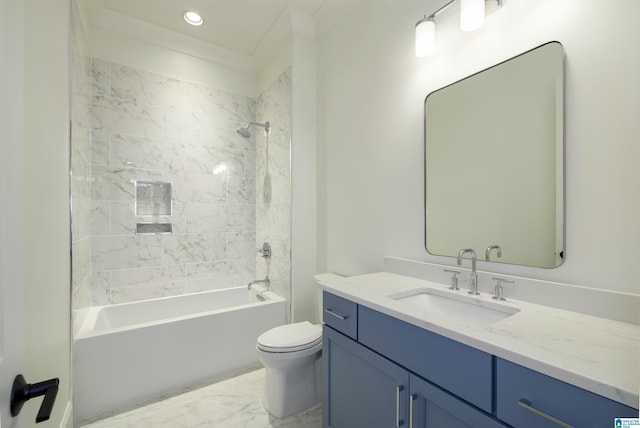 full bathroom featuring toilet, vanity, ornamental molding, and tiled shower / bath