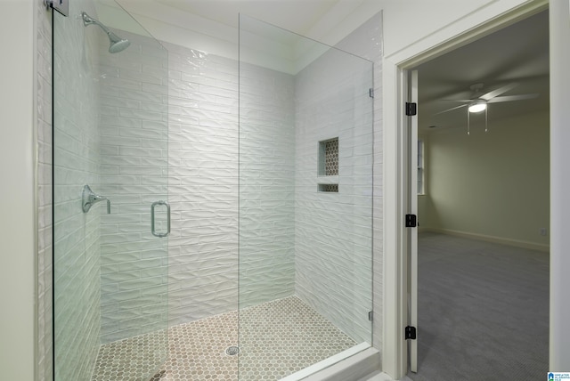 bathroom featuring an enclosed shower and ceiling fan