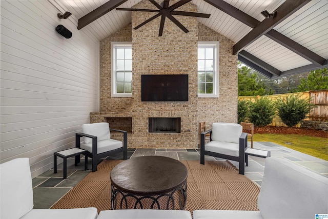 view of patio / terrace featuring an outdoor stone fireplace