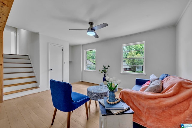 living room featuring ceiling fan and light wood-type flooring