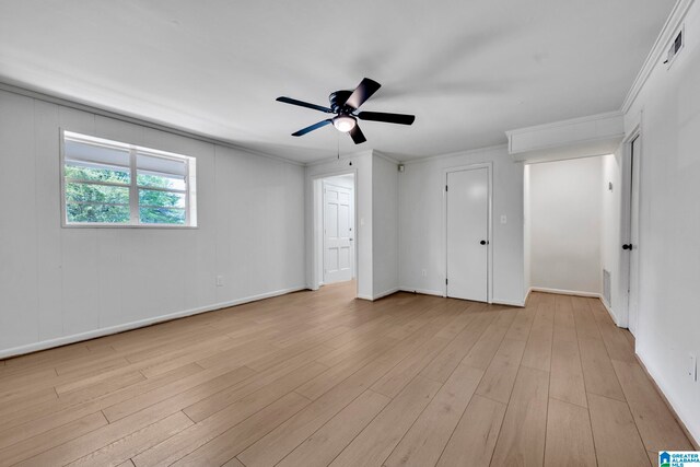 unfurnished bedroom featuring ornamental molding, light wood-type flooring, and ceiling fan