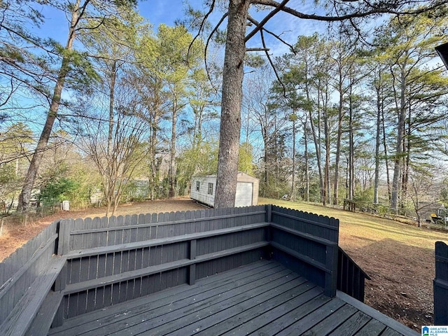 wooden terrace featuring an outbuilding